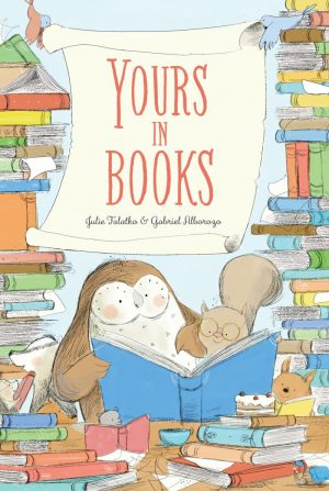 An owl and a squirrel read together amongst piles of books. Title: Yours in Books. Author: Julie Falatko, Illustrator: Gabriel Alborozo